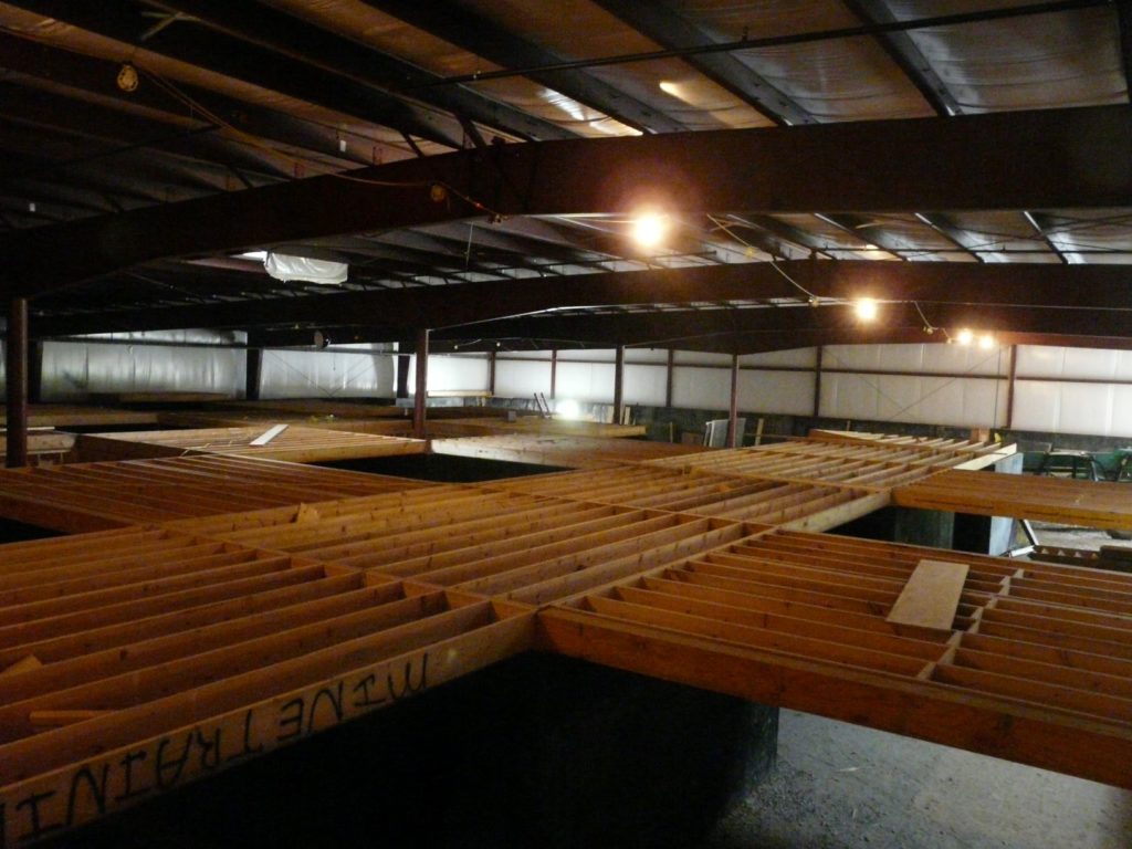 The framed lumber roof and walls of the United Mine Workers training mine structure during deconstruction.
