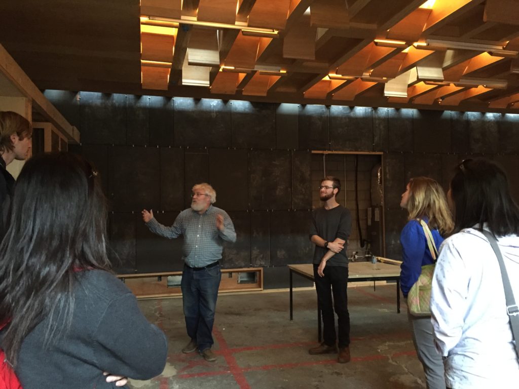 A group of Pitt students tours the CJ community room space. 