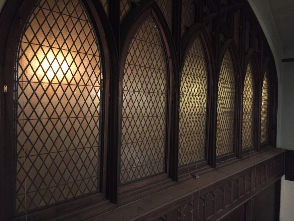 Individual archtop windows with leaded glass.