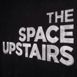 The Space Upstairs white on black chalk logo