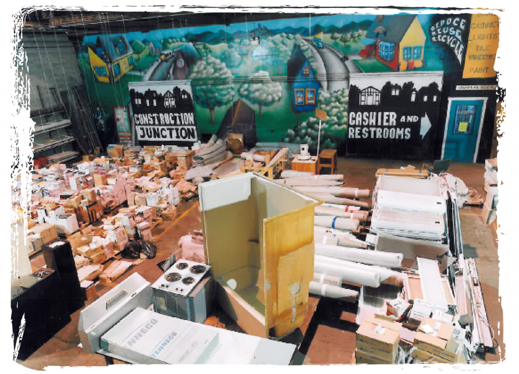 FirstStoreFirstDayRoughFrame Various items for sale on the first day of operation, Nov. 12, 1999, in the original CJ retail store, which had a large mural painted on the back wall.