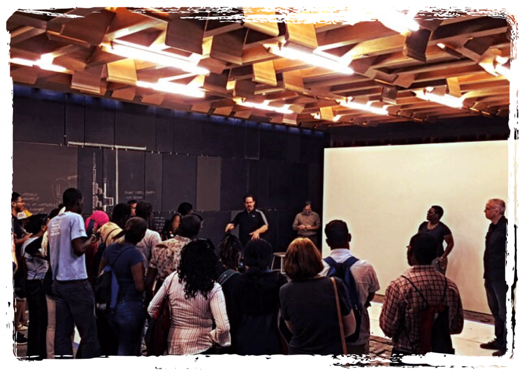 Impact - interior of the community room with pew bench ceiling light diverters.