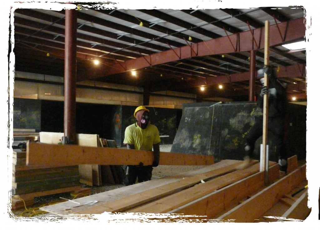 South Hilltop Men's Group trainees working inside the United Mine Workers training center deconstruction project.