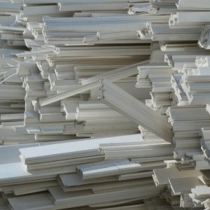 PVC window framing awaiting processing.