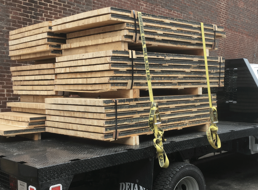 Reclaimed bowling lane slabs loaded for delivery from Construction Junction